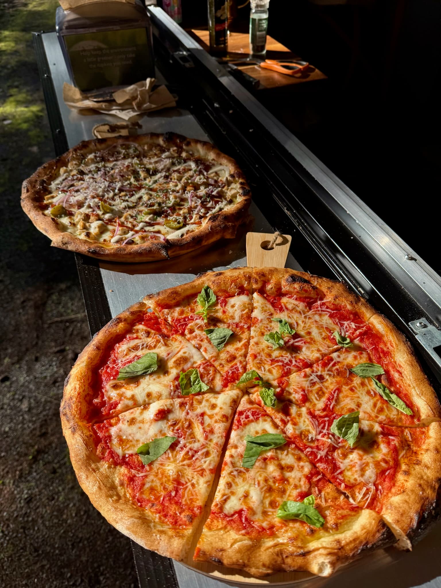 Freshly baked wood-fired pizza with classic Neapolitan toppings ready to serve