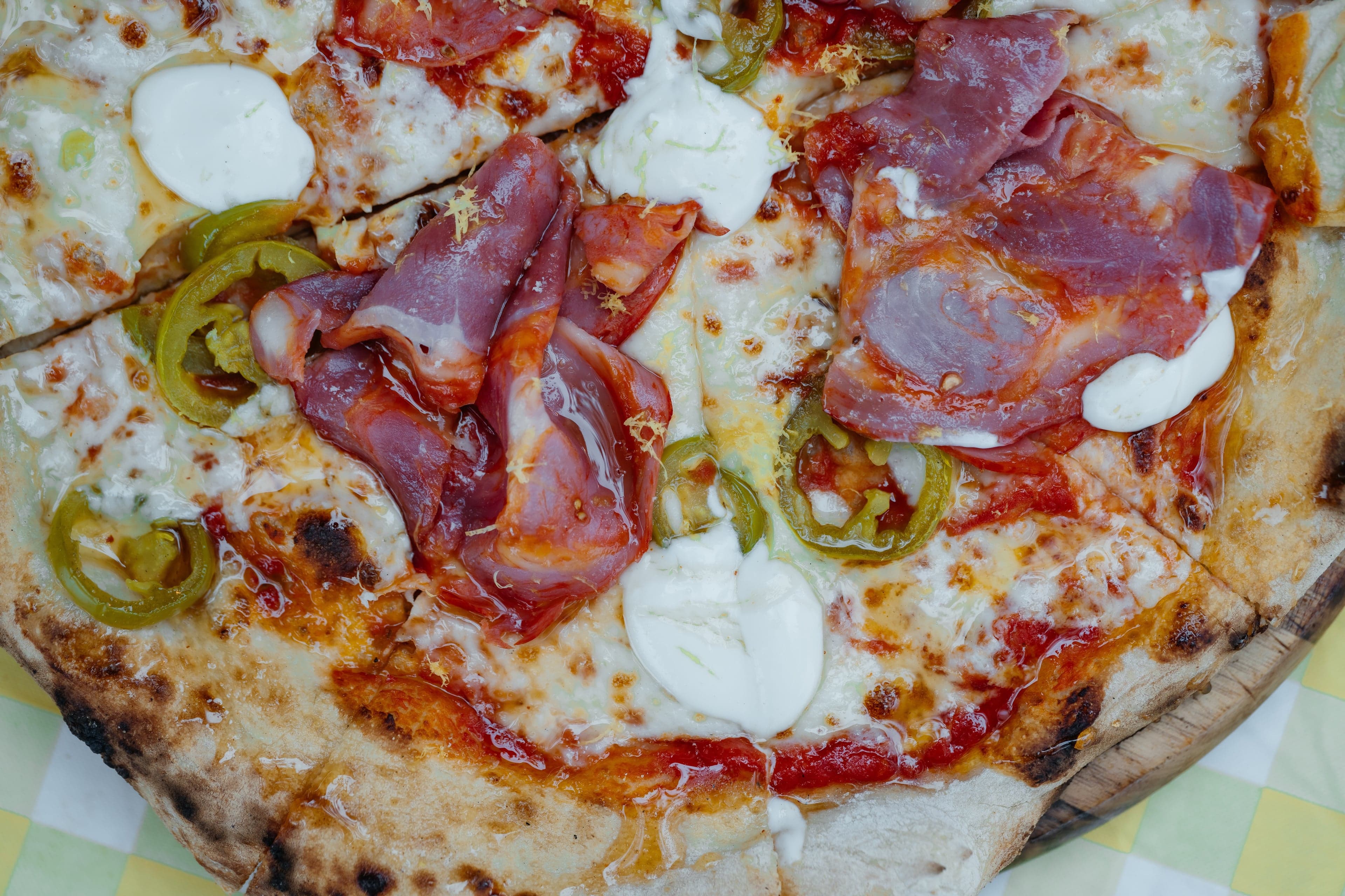 Multiple pizzas lined up fresh from the oven at a Forno Via catered event