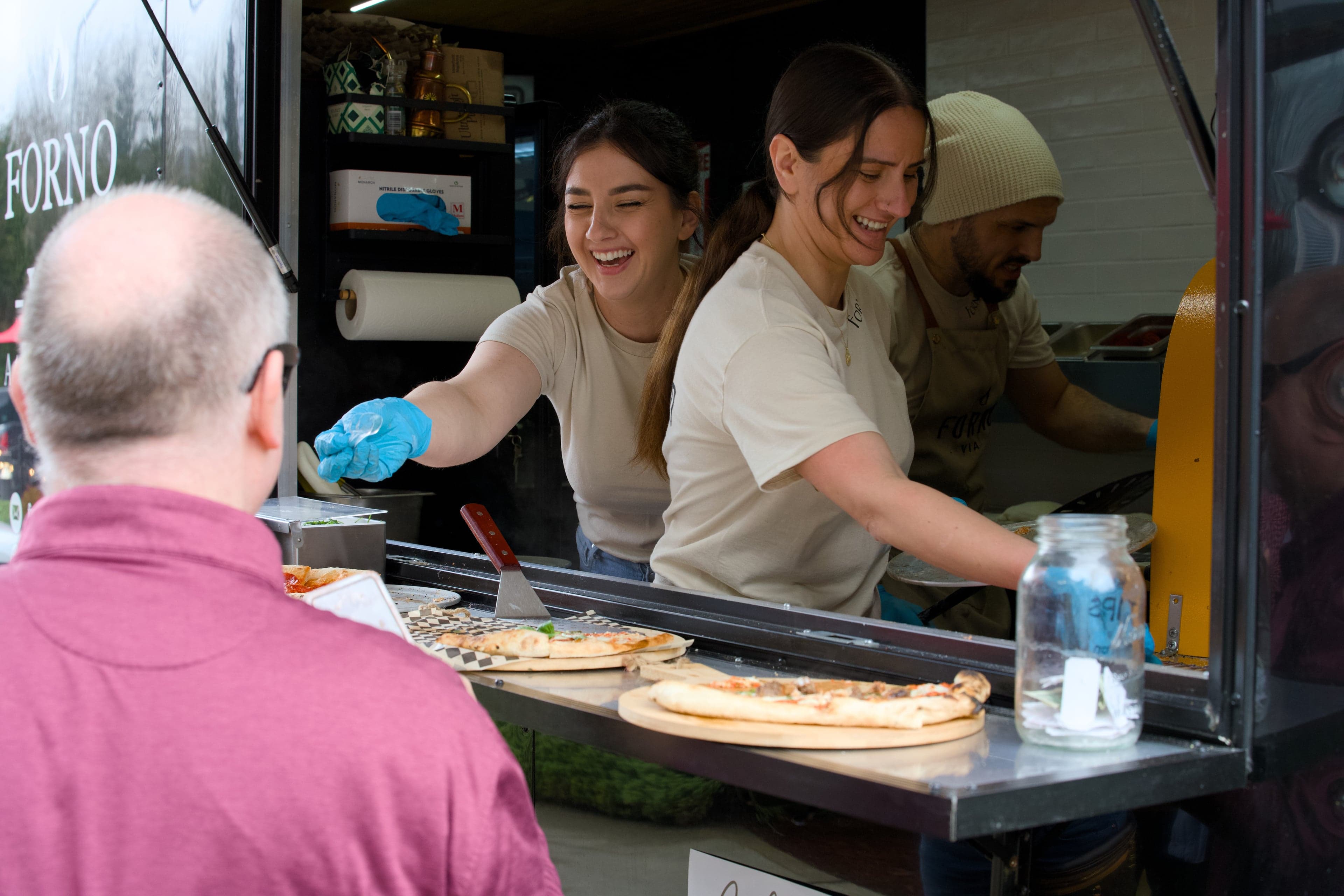 Fresh Neapolitan pizza with authentic toppings served at a Forno Via catered event